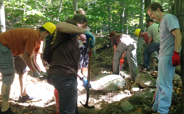 Volunteers working on trail tread.